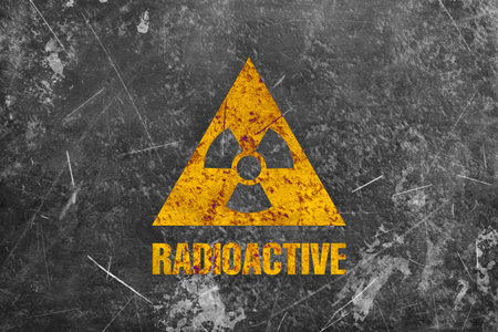 Radioactive sign on grey textured surface. Radiological pollutionの写真素材