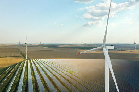 Wind turbines and solar panels outdoors. Alternative energy source