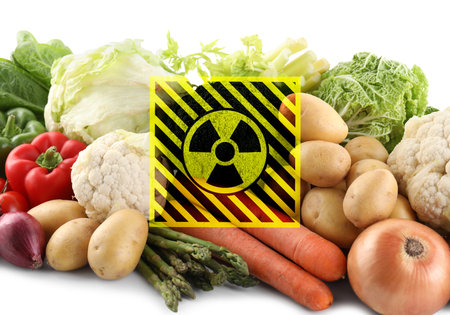 Fresh vegetables and radioactive sign on white background. Environmental contamination, polluted foodの写真素材
