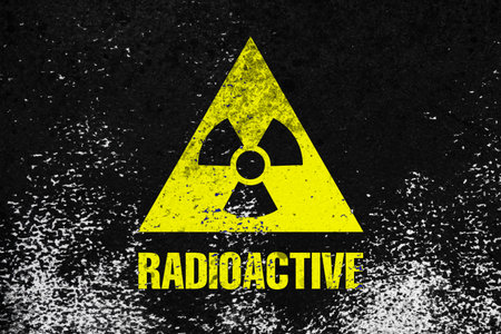 Radioactive sign on black textured surface. Radiological pollutionの写真素材