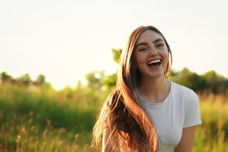 Feeling freedom. Happy young woman in nature, space for text