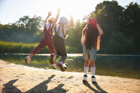 Cute little girls spending time in nature on sunny day