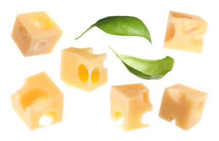Cheese cubes and green basil leaves isolated on white, set