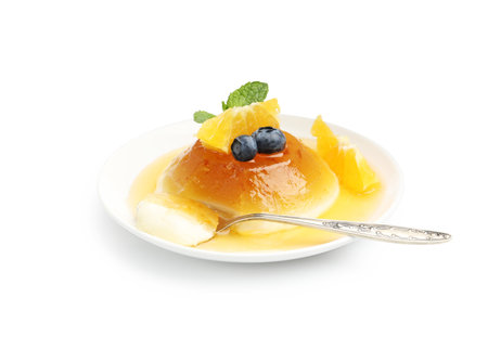 Tasty dessert with orange, blueberries and mint isolated on white