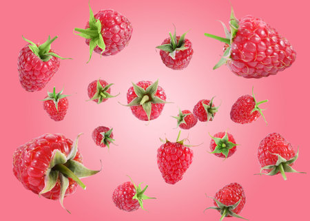 Fresh raspberries swirling in air against pink gradient background