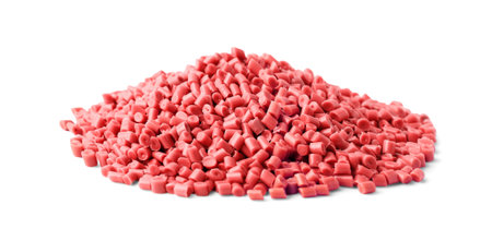 Pile of red plastic granules isolated on white