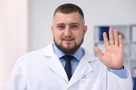 Portrait of doctor in uniform in clinic