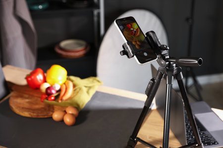 Shooting vegetables with smartphone in studio, selective focus. Professional food photographyの写真素材