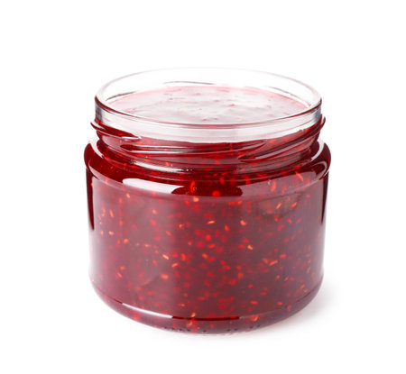 Sweet raspberry jam in glass jar isolated on white