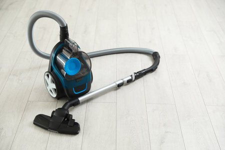 One vacuum cleaner on wooden floor. Household applianceの写真素材