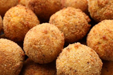 Delicious fried croquette balls as background, closeup