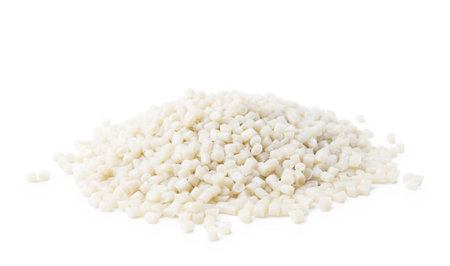 Pile of white plastic granules isolated on whiteの写真素材