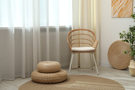 Stylish furniture near window with curtains in living room. Interior designの写真素材