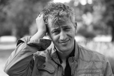 Portrait of man outdoors. Black and white effectの写真素材