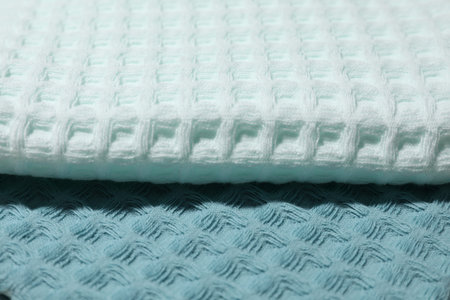 Clean waffle towels as background, closeup view