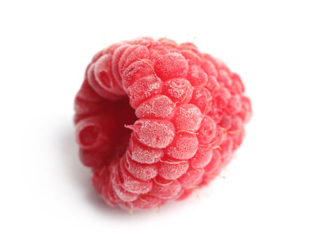 One frozen raspberry isolated on white, macro view