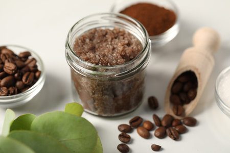 Natural body scrub and ingredients on white table, closeupの写真素材