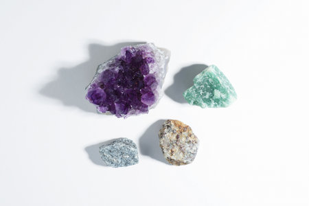 Aura. Different natural mineral stones on white background, flat layの写真素材