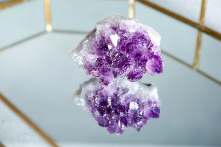 Aura. Beautiful amethyst on glass tray, closeup