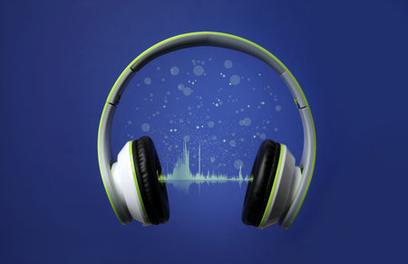 Headphones and sound waves against blue background