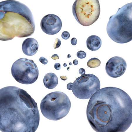 Fresh blueberries swirling in air against white backgroundの写真素材