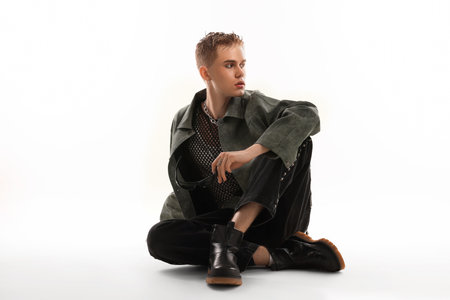 Young man wearing stylish jacket on white backgroundの写真素材