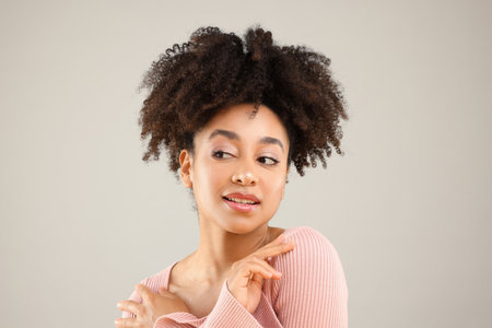 Portrait of beautiful woman on gray background