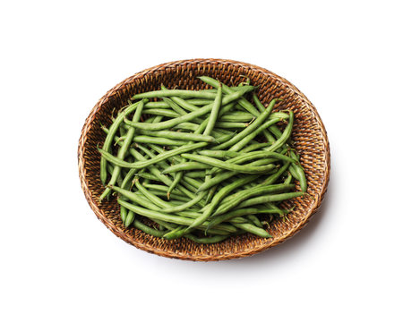 Fresh pea pods in wicker basket isolated on white, top view