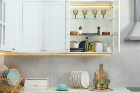 Different dishware, glasses and other kitchen utensils indoors