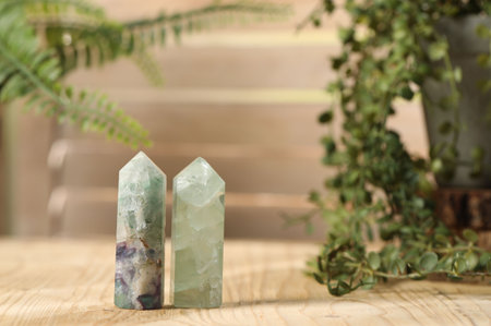 Aura. Beautiful crystals on wooden surface indoors