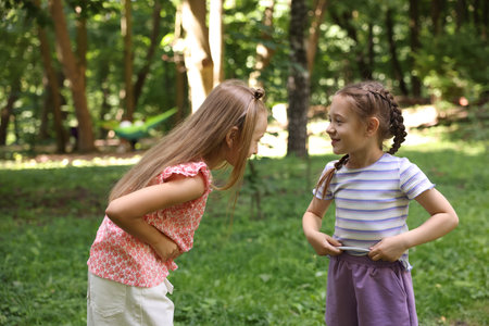 Cute little kids having fun together in parkの写真素材