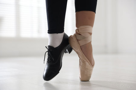 Teenage girl in tap and pointe shoe indoors, closeup