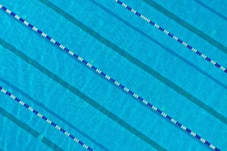 Aerial view of outdoor swimming pool on sunny dayの写真素材