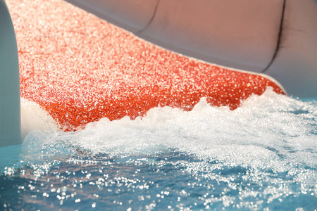 Wide slide at water park, closeup. Summer vacation