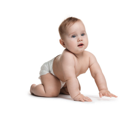 Cute little baby crawling on white backgroundの写真素材