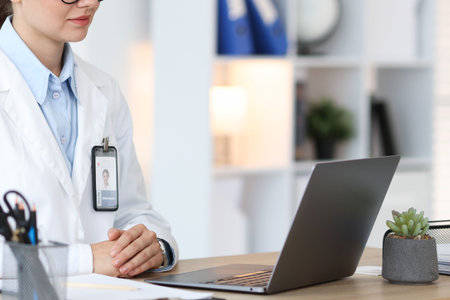 Telemedicine. Doctor having video call with patient via laptop indoors, closeupの写真素材