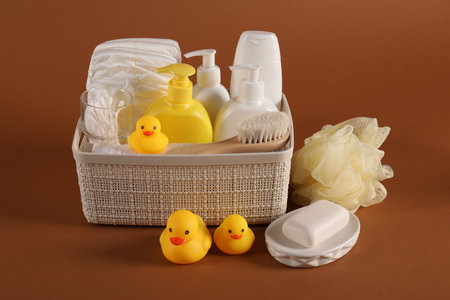 Baby accessories and body care products on brown backgroundの写真素材