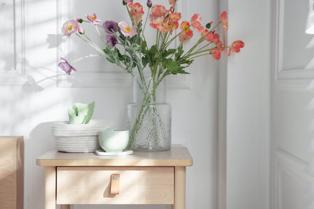 Bedside table with different decor at homeの写真素材