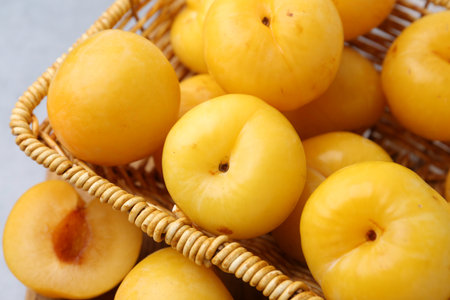 Ripe yellow cherry plums on grey table, closeupの写真素材