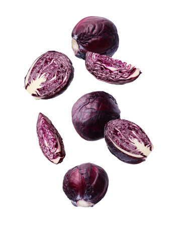 Fresh red cabbages falling on white backgroundの写真素材