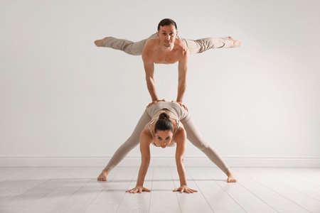 Couple of professional dancers training in studio