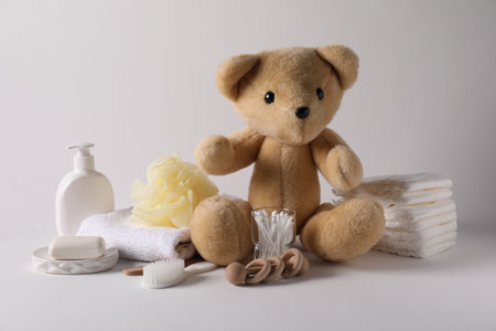Baby accessories and body care products on light gray backgroundの写真素材