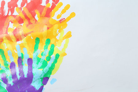 Tolerance concept. Heart of colorful handprints on white background, closeup. Space for textの写真素材