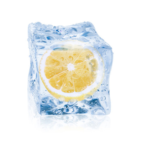 Cut fresh lemon fruit in ice cube isolated on whiteの写真素材