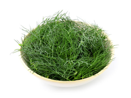 Fresh dill in bowl isolated on whiteの写真素材