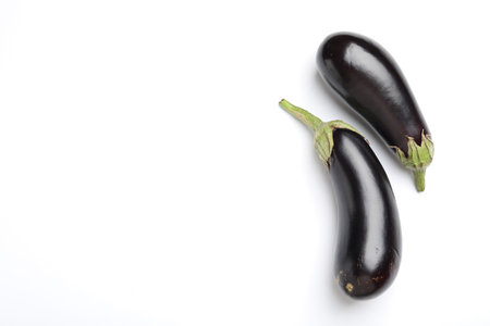 Fresh eggplants on white background, top view. Space for textの写真素材