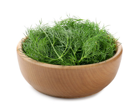Fresh dill in bowl isolated on whiteの写真素材