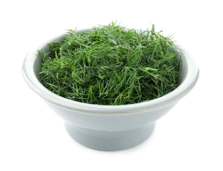 Fresh cut dill in bowl isolated on whiteの写真素材