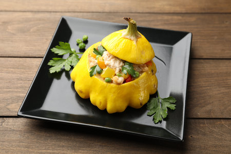 Tasty stuffed pattypan squash on wooden table, closeupの写真素材