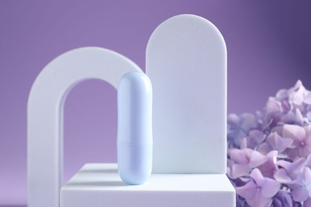 Promotion. Cosmetic product, podiums and hydrangea flowers on violet background, closeupの写真素材